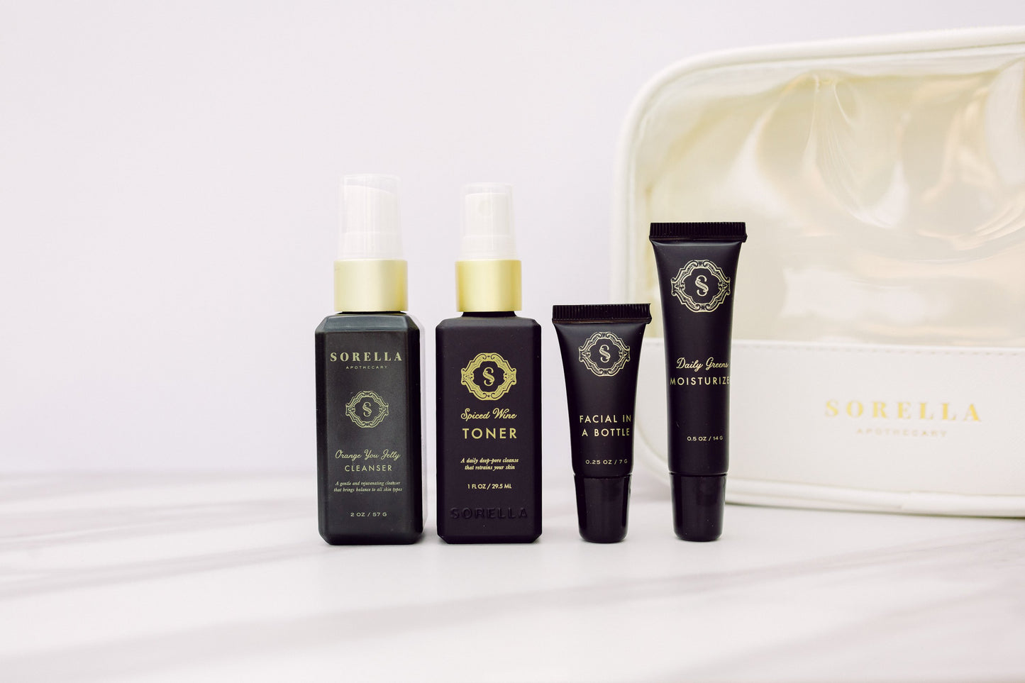 The Clear Skin Kit includes travel size versions of the Orange You Jelly Cleanser, Spiced Wine Toner, Facial in a Bottle and Daily Greens Moisturizer