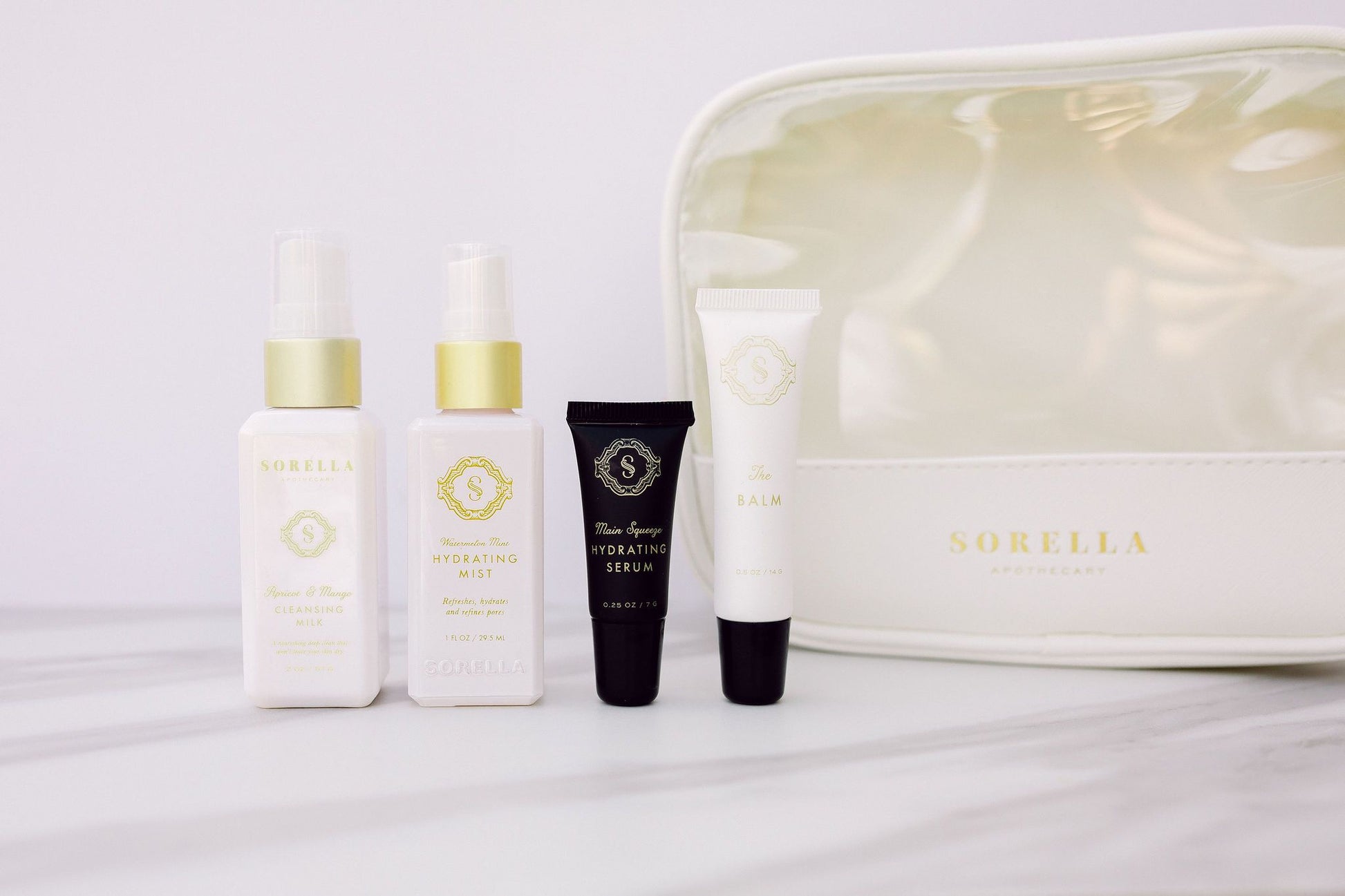 The Healthy Aging Kit includes travel size versions of the Apricot Mango Cleansing Milk, Watermelon Mint Hydrating Mist, Main Squeeze Hydrating Serum and The Balm